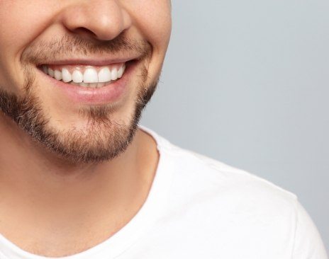 Close up of smiling man with short beard
