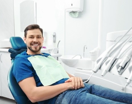 Smiling man leaning back in dental chair