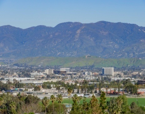 Aerial view of city with mountains in background