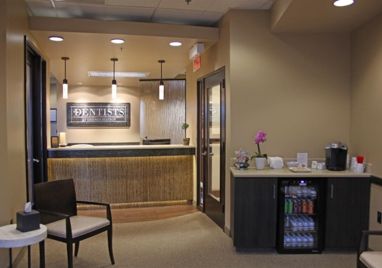 Front desk next to small fridge with beverages