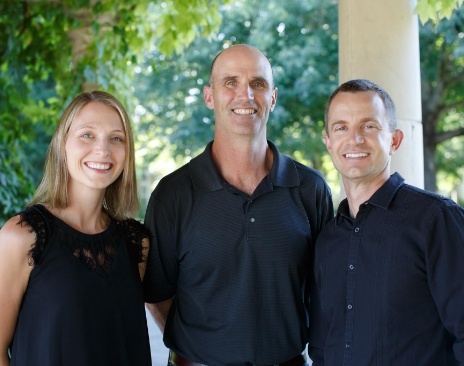 Three smiling Hillsboro dentists at The Dentists at Orenco Station