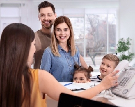 Woman holding clear aligner and payment card